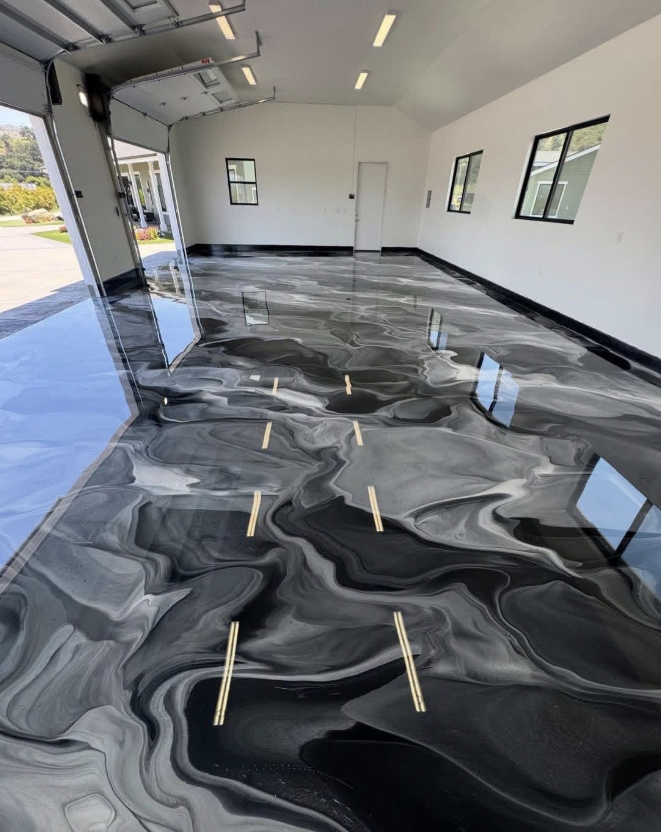 Dramatic black and grey metallic epoxy garage floor Adelaide South Australia